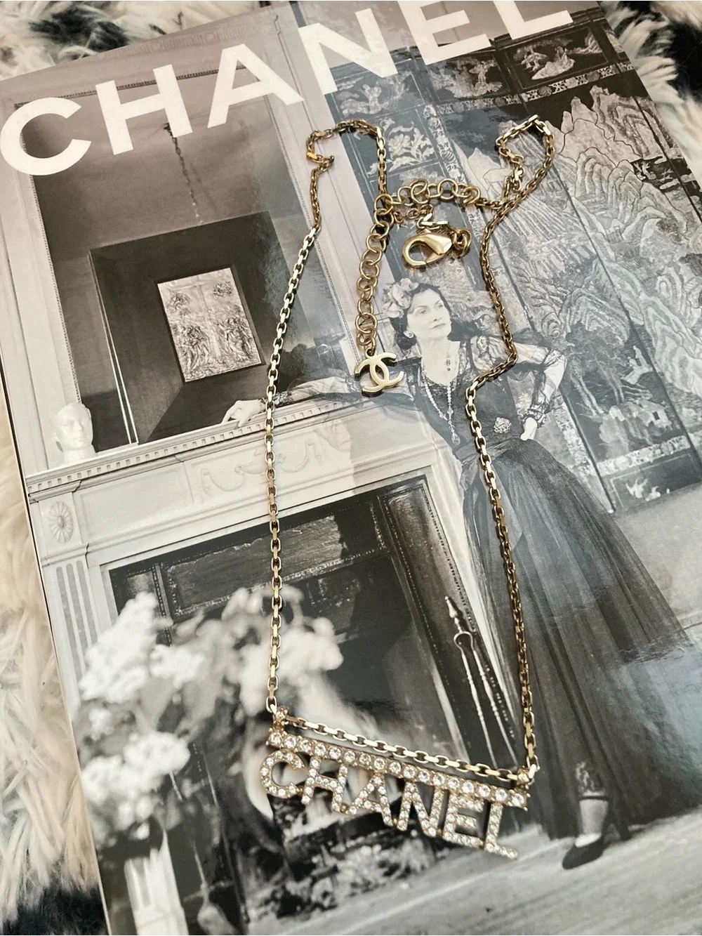 CHANEL Gold and Clear Crystal Logo Necklace